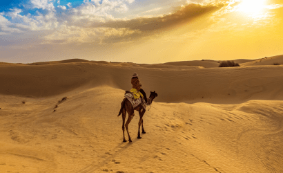 women-riding-camel-alone-at-desert-of-merzouga-best-tour-of-morocco–410×250